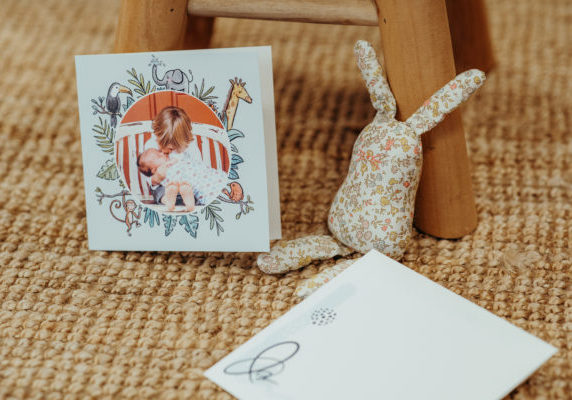 card on coconut mat with rabbit soft toy