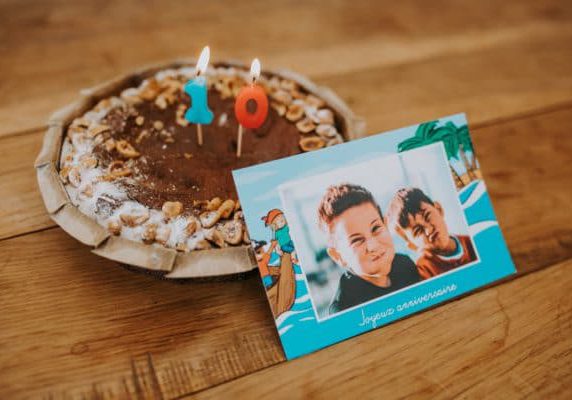 child's birthday card in front of chocolate cake