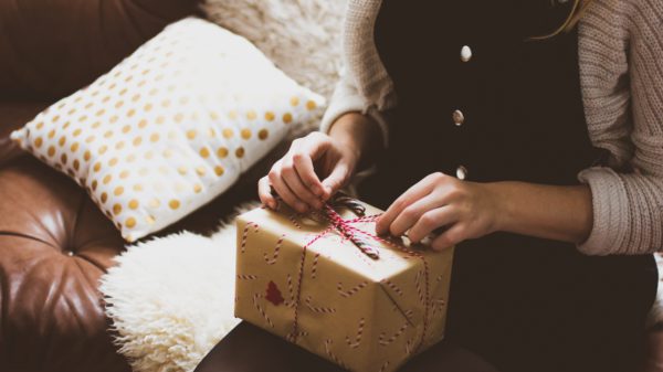 Christmas present on woman's lap