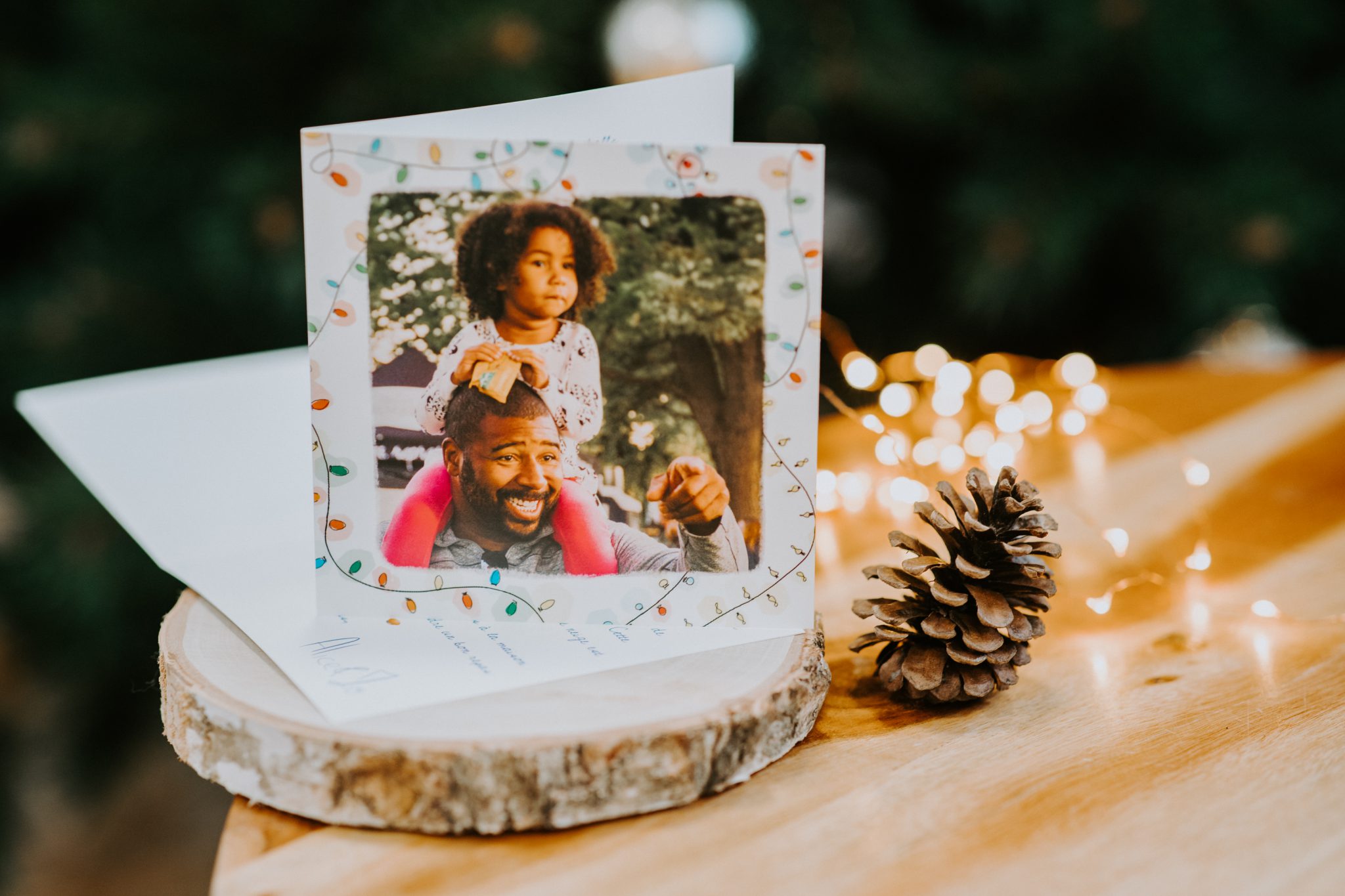 Weihnachtskarte mit Girlanden für Vater und Tochter