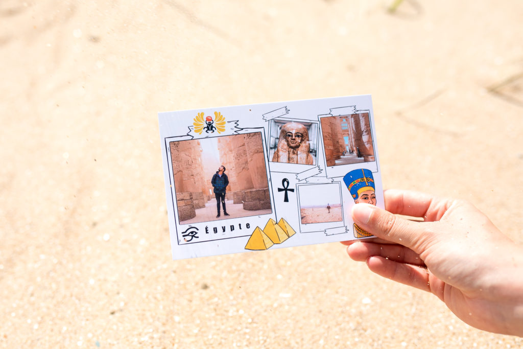 Egypt postcard with statues on the sand