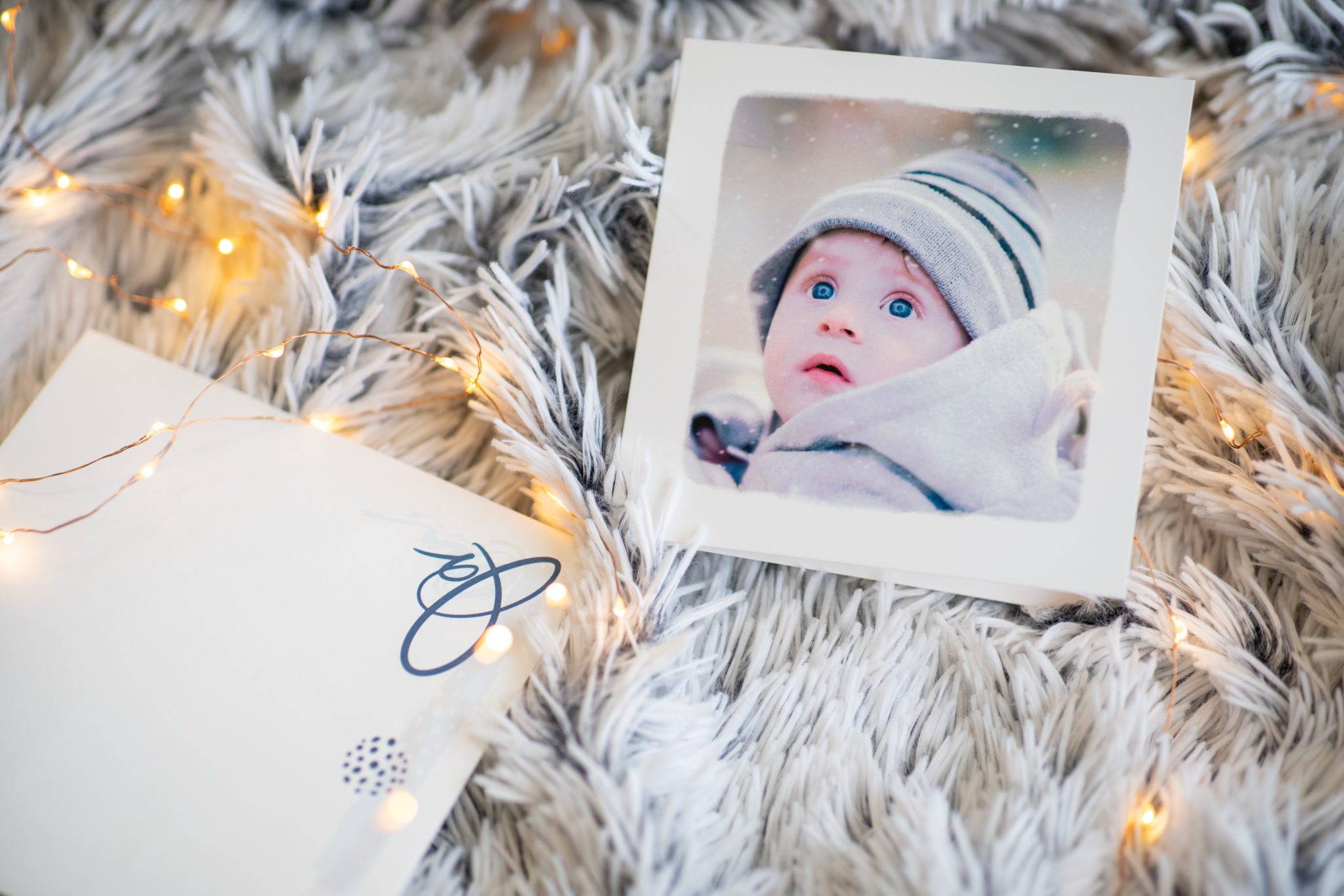 card with unique baby photo and garland